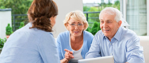 Senior move manager speaking with 2 senior clients