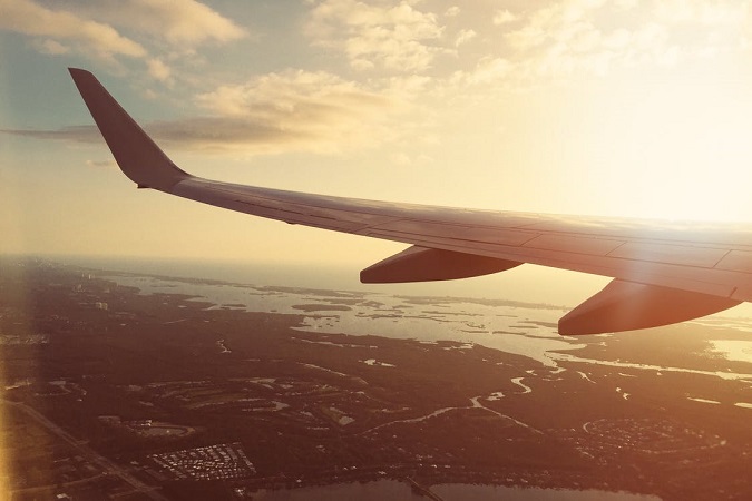 Looking outside of an airplane over water