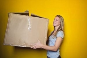 Girl Carrying Box 