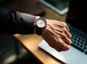 Man looking down at his watch