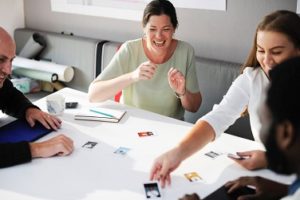 two women and two men working on a project together at work